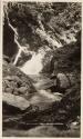 Camping companion by waterfall, Labrador Trip