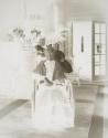 Dryden children posing with Maria Eastman in Conservatory