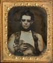 [Blind man holding a cat]