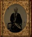 [Man playing drum]