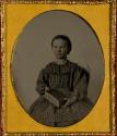 [Seated young girl]