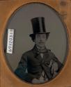 [Seated man with top hat, and mother and child]