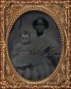 [African American woman holding baby]