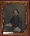 [Seated young woman]