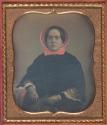 [Woman wearing a pink bonnet]