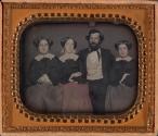 [Three women and one man]