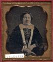 [Woman wearing velvet jacket]