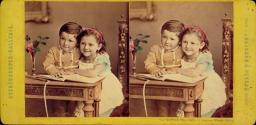 [Two children with book]