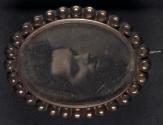 [Mourning pin of deceased young man]