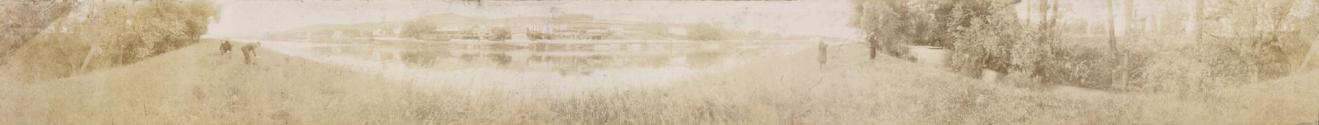 [Panoramic riverbank scene]