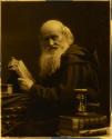 [Man with books and hourglass]