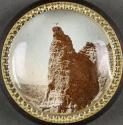 [Yellowstone Park glass paperweight with photograph of eagle taking flight off rock]