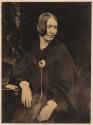 [Seated woman wearing brooch]