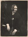 [Seated woman wearing brooch]