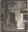 [Boy sitting in doorway of Tailor's Hall, Potterrow]