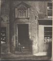 [Boy sitting in doorway of Tailor's Hall, Potterrow]