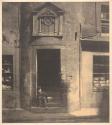 [Boy sitting in doorway of Tailor's Hall, Potterrow]