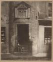 [Boy sitting in doorway of Tailor's Hall, Potterrow]