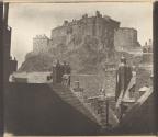 [Edinburgh Castle over the rooftops of the Grassmarket]