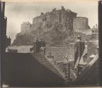 [Edinburgh Castle over the rooftops of the Grassmarket]