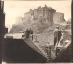 [Edinburgh Castle over the rooftops of the Grassmarket]