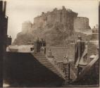 [Edinburgh Castle over the rooftops of the Grassmarket]