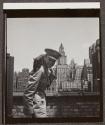 [Beaumont Newhall with black cat in New York City]