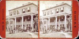[group of people in front of hotel, probably in LeRoy New York]