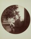 [Portrait of man holding hat]