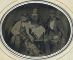 [Standing woman, two seated men, and dog]