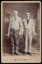 [Two young men holding tools]
