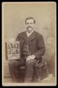 [Man with ornate bible]