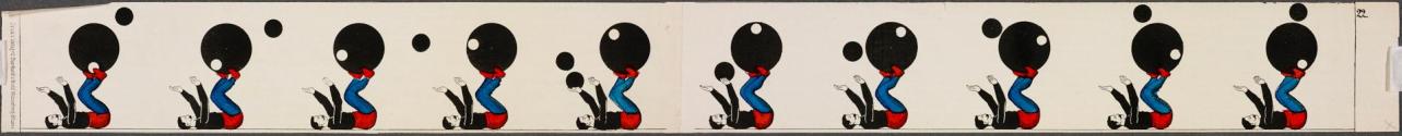 [Man throwing ball over larger ball he is balancing on his feet]