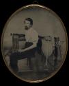 [Saddler posing with tools]