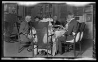George Eastman and guests eating dinner, Oak Lodge Trip