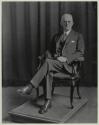 George Eastman seated in chair