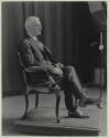 George Eastman seated in chair