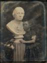[Helia Harrison with a bust of George Washington]