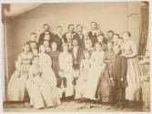 [Women, children and men in wedding group portrait]