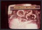 [TV showing Apollo 16 broadcast]