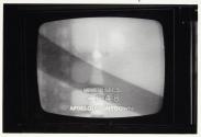 [TV showing Apollo 16 broadcast]