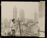 [Engineer with surveyors level, Empire State building]