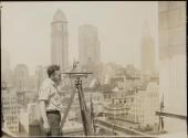 [Engineer with surveyors level, Empire State building]