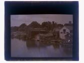 [Buildings along water]