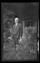 George Eastman in garden on his 77th birthday