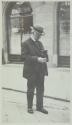 George Eastman holding a camera