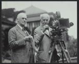 George Eastman & Thomas Edison demonstrating camera at Kodacolor Party