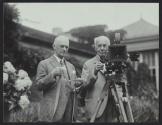 George Eastman and Thomas Edison demonstrating camera at Kodacolor Party