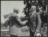 George Eastman shaking hands with General Pershing