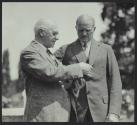 George Eastman demonstrating a camera to General Pershing